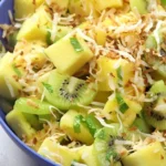 Delicious Pineapple Kiwi Salad served in a bowl with fresh fruits