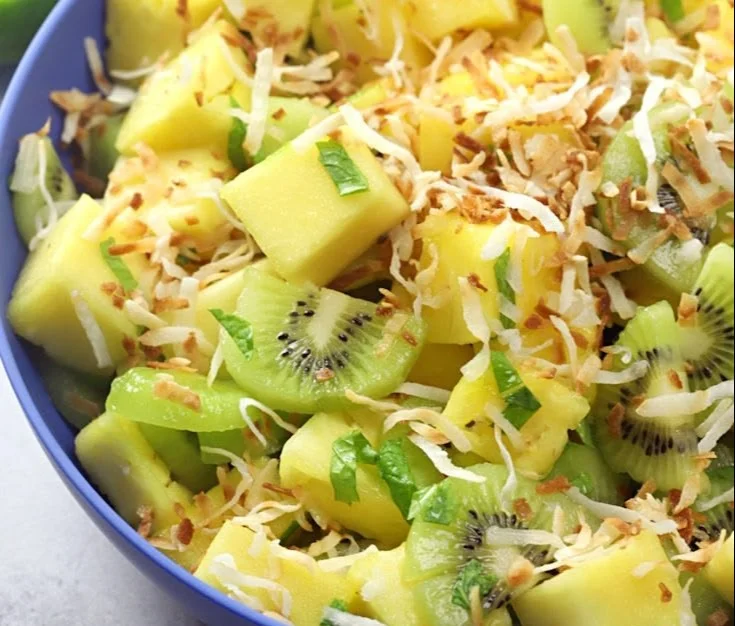 Delicious Pineapple Kiwi Salad served in a bowl with fresh fruits