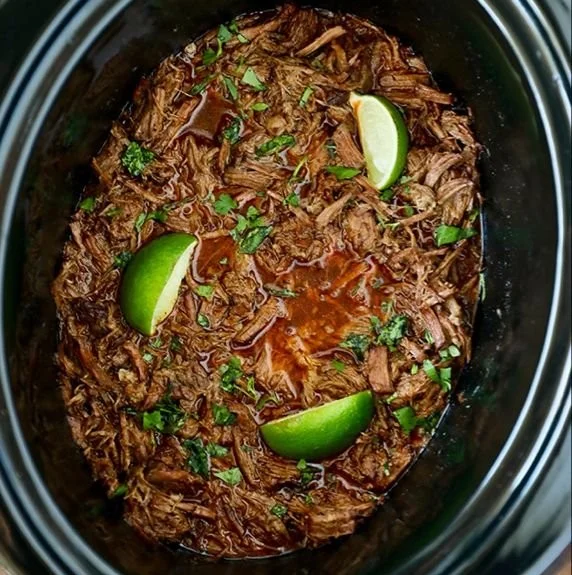 Delicious slow cooker beef barbacoa served with tortillas