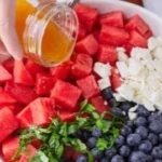 Colorful watermelon blueberry feta salad served in a bowl
