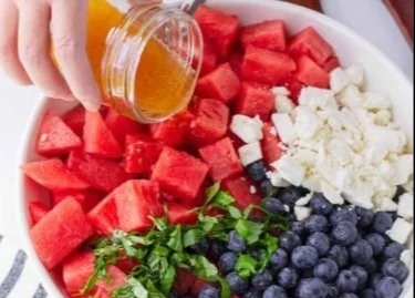Colorful watermelon blueberry feta salad served in a bowl